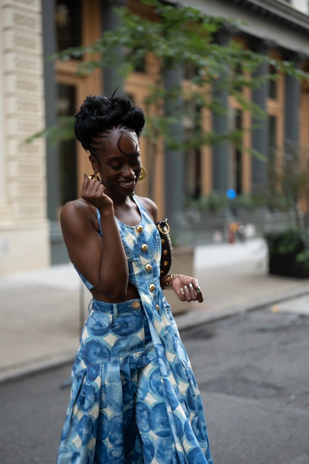 Close portrait of Ashley wearing Bohn Jsell’s blue Palerma Halter Vest and Paloma Pant.